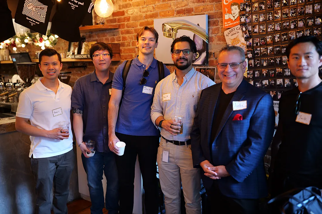 Attendees posing together during the networking hour
